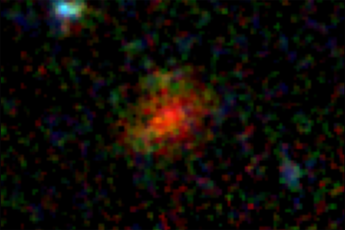 A diffuse red patch emerges from the center of an inky black background