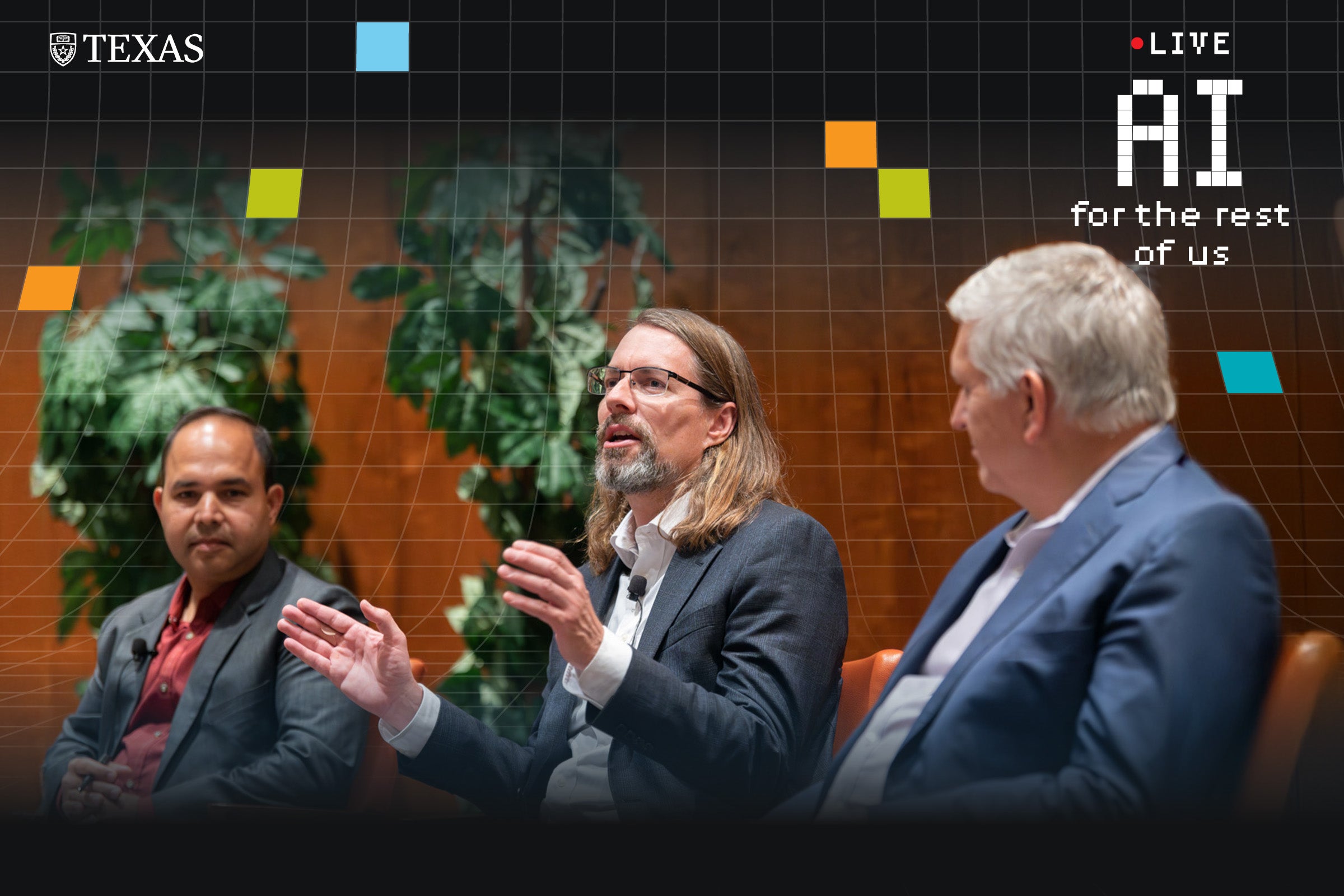 Three speakers at a panel discussion