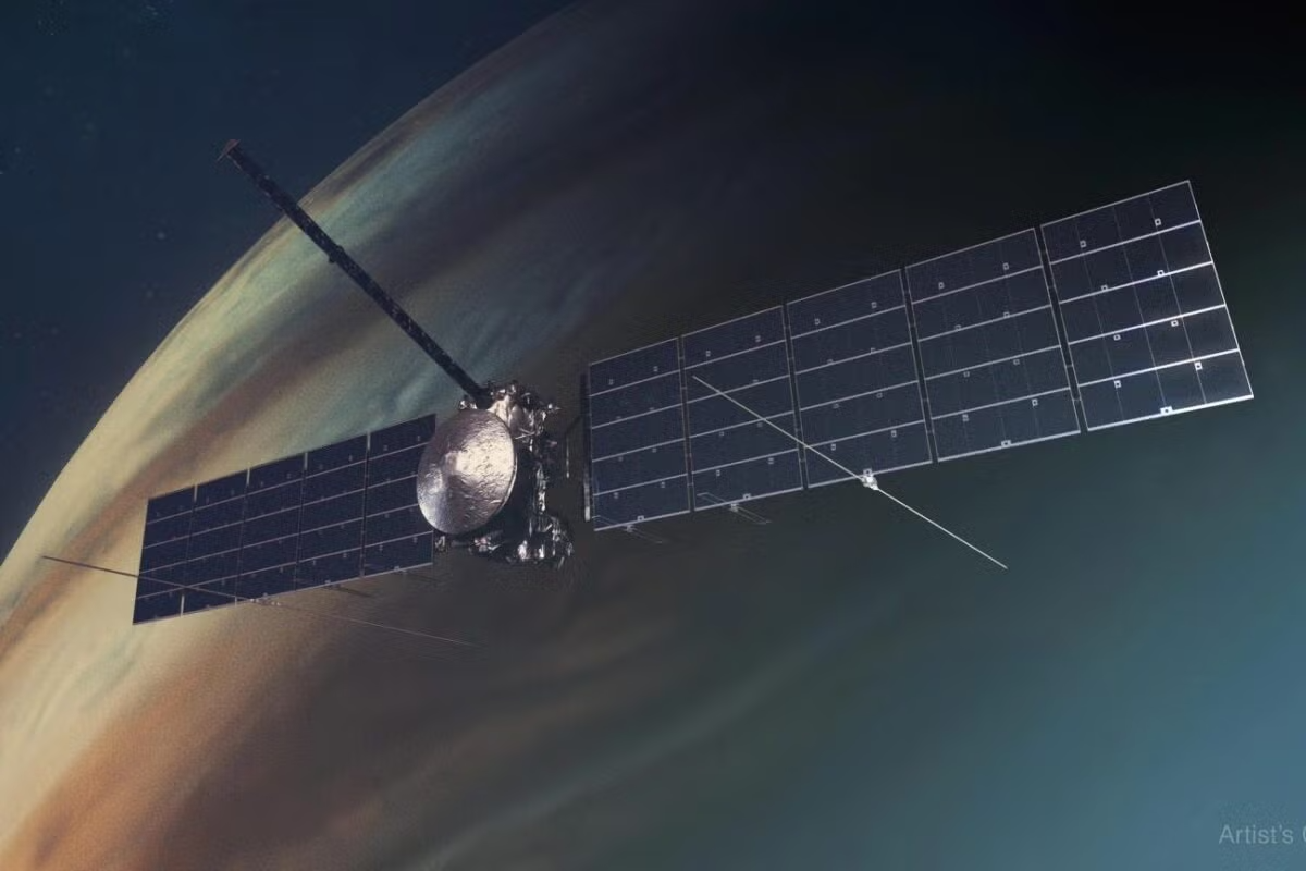 A space monitoring vessel, NASA’s Europa Clipper, hovers above a planet.