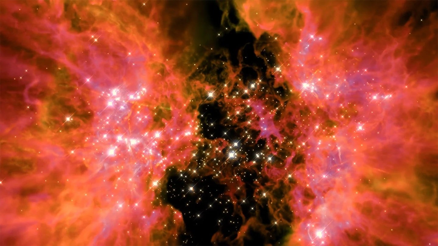 A pair of pinkish molecular clouds dotted with bursts of light in space represent star-forming activity.